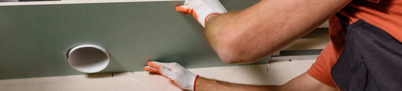 A detail of technician working on a ceiling